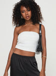 Tube top Strapless style, elasticated bust, shirred material, invisible zip fastening Non-stretch material, fully lined  