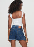 Denim skort High rise fit, classic five pocket design, belt looped waist, zip & button fastening, branded patch at back, raw edge hem Non-stretch material, unlined  Princess Polly Lower Impact 