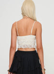 Crop top Lace material, straight neckline, adjustable straps, bow detail, lettuce edge hem Good stretch, fully lined 