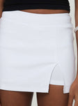 Mid rise skort Built-in shorts, split at leg, thick waistband Good stretch, unlined 