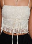 Crop top Lace material, straight neckline, adjustable straps, bow detail, lettuce edge hem Good stretch, fully lined 