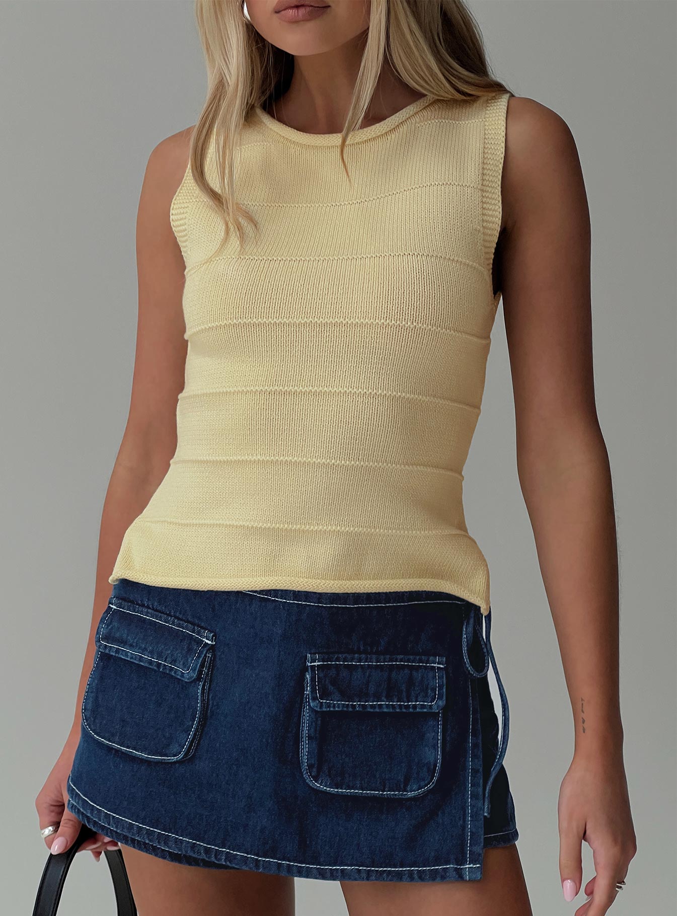front view of model wearing Princess Polly Hisplane Knit Top Cream Sleeveless Crew Neck 