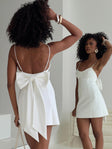 back view of model wearing Princess Polly Bow Me Up Mini Dress White Scoop Neck 