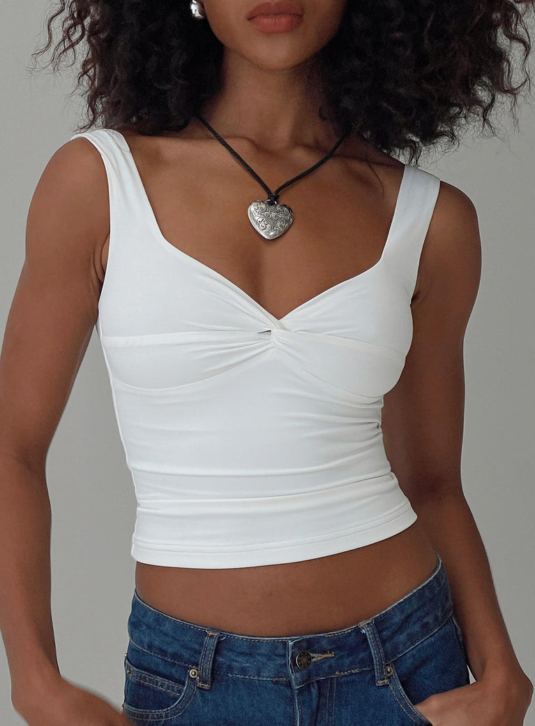 front view of model wearing Princess Polly Una Top White Sleeveless Sweetheart 