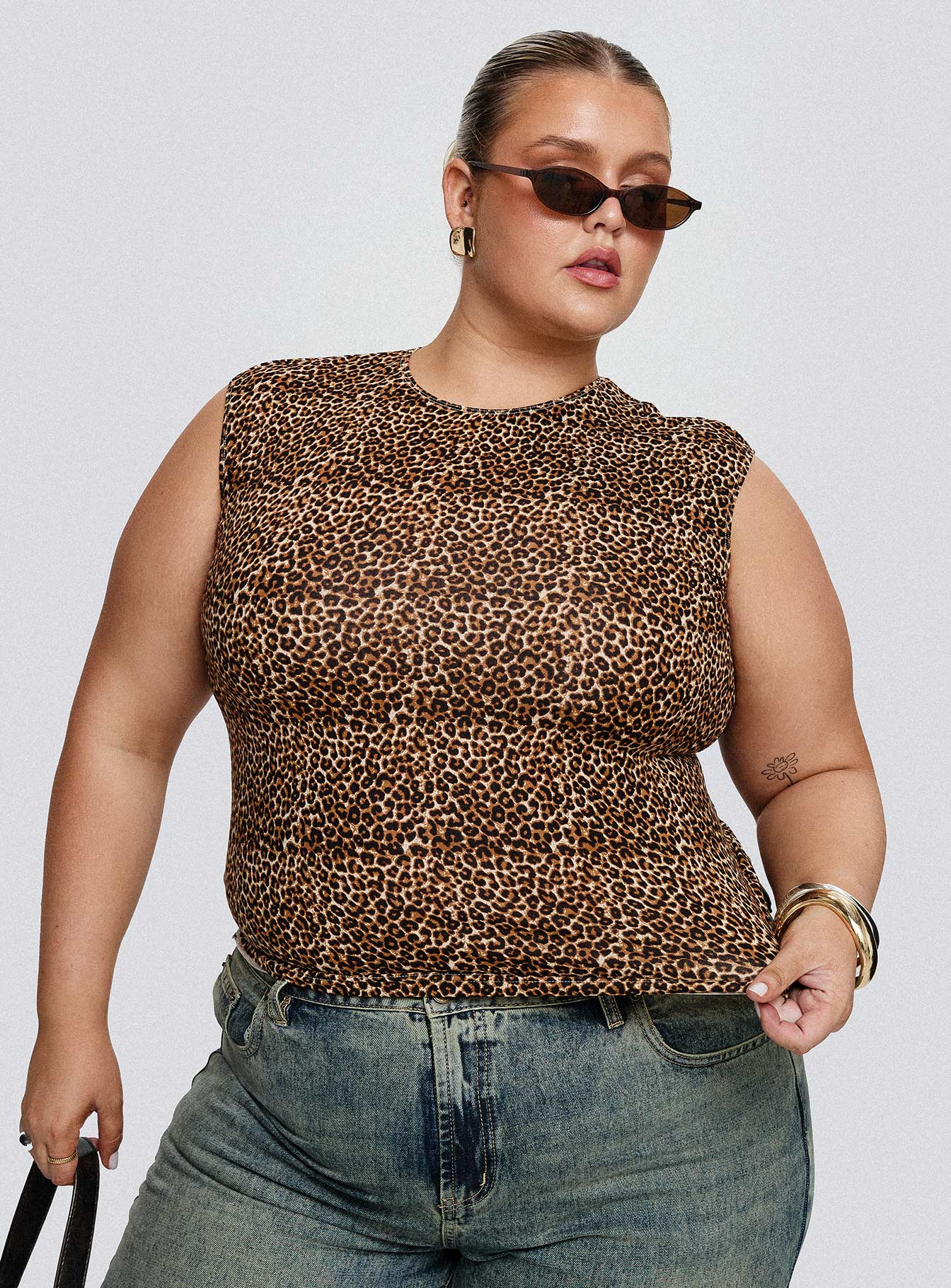 front view of model wearing Princess Polly Lure Top Leopard Curve Sleeveless Crew Neck 