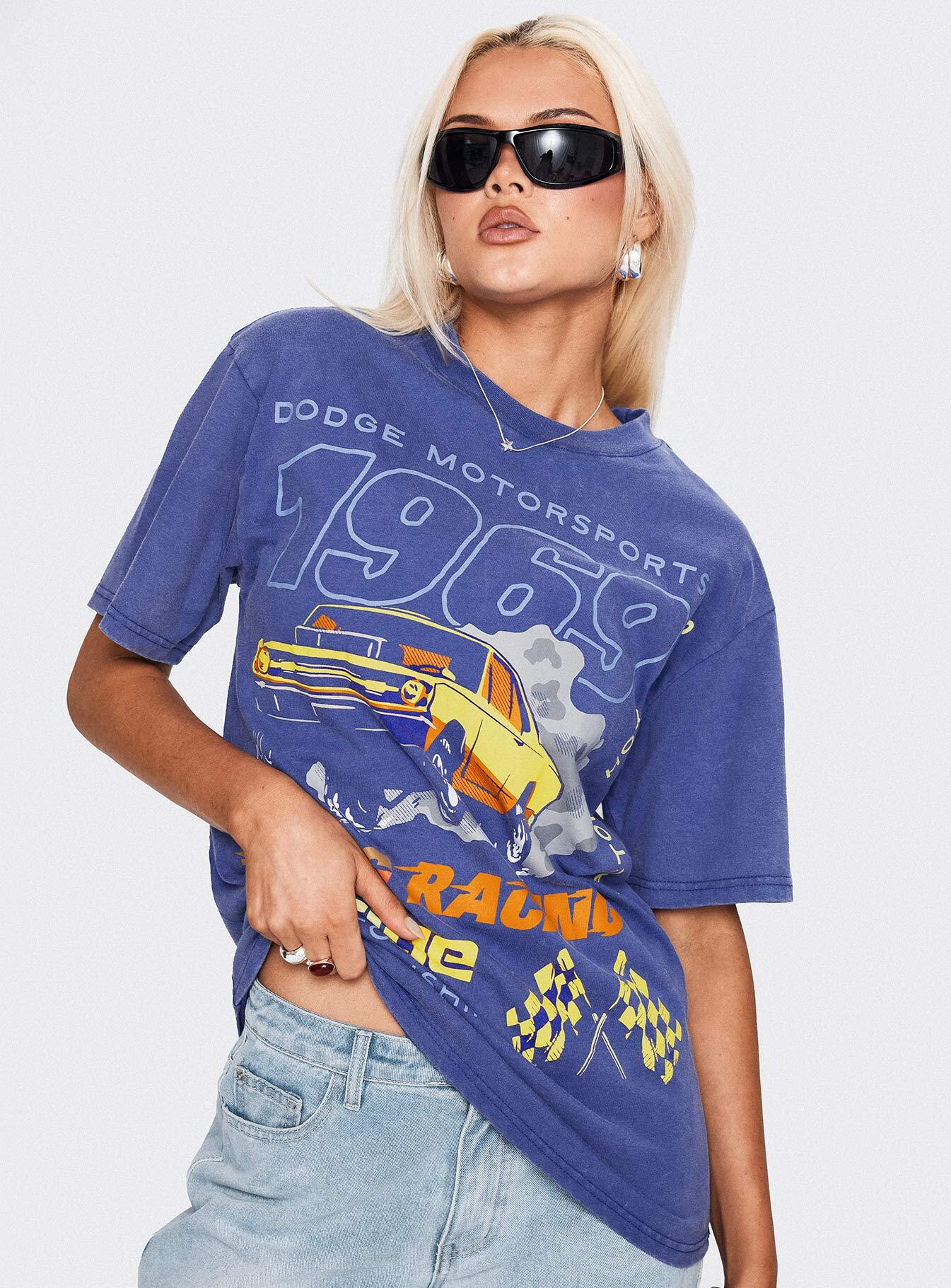 back view of model wearing Princess Polly Dodge 1969 Oversized Graphic Top Blue Half Sleeves Crew Neck 