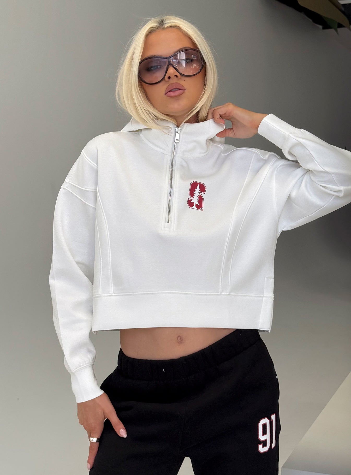 front view of model wearing Princess Polly Stanford Buttersport Half-zip Hoodie White cropped 