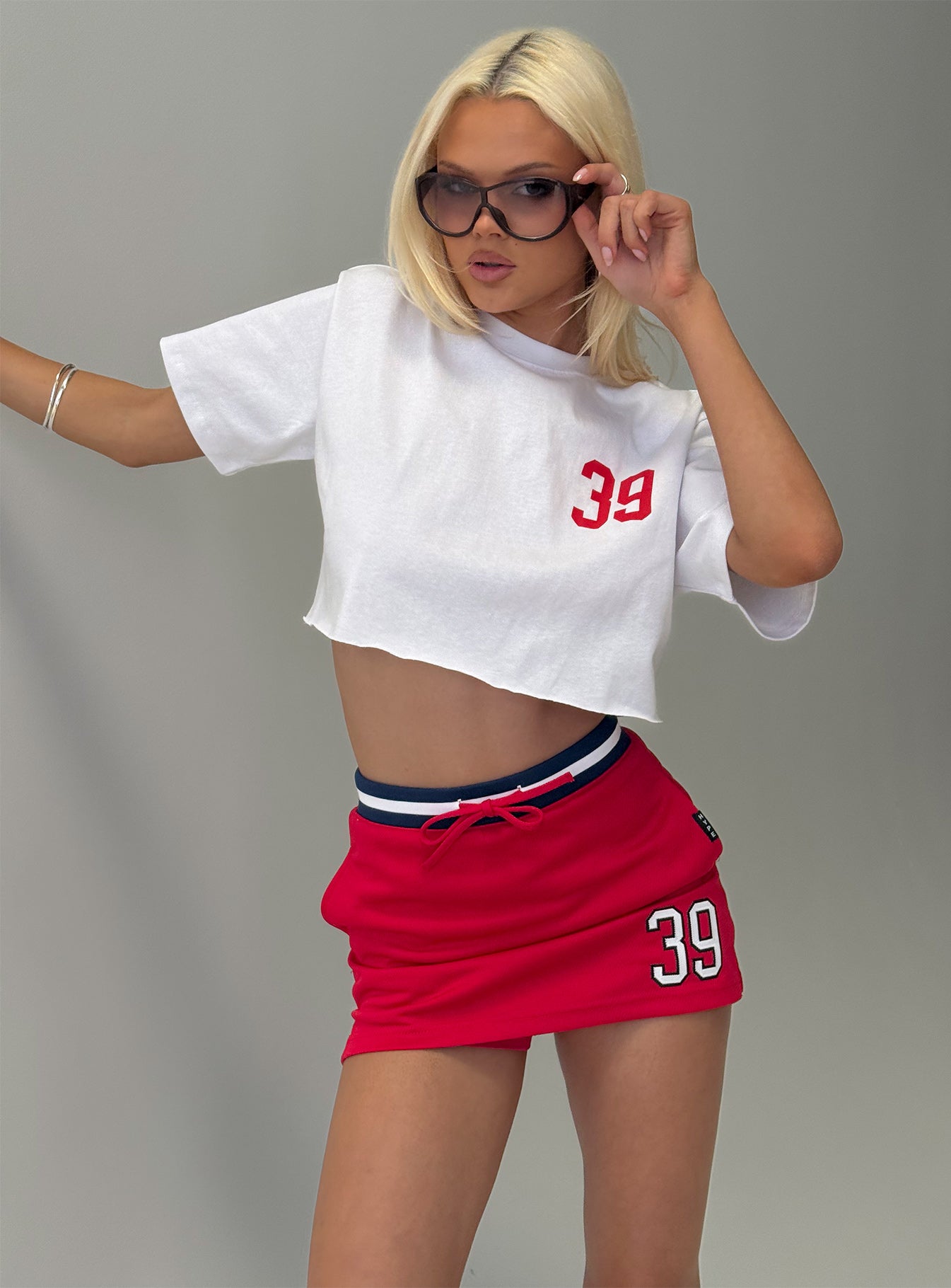   front view of model wearing Princess Polly Boston University Basketball Skirt Red Mini Skirts 