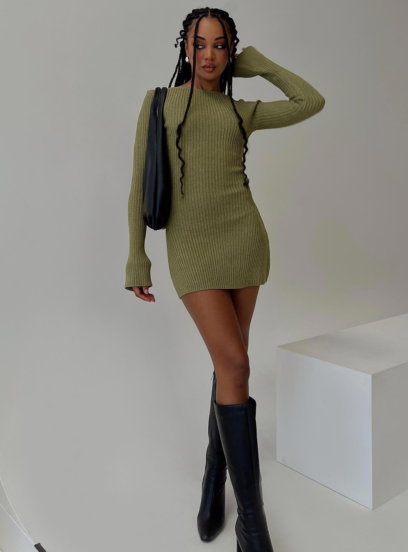 side view of model wearing Princess Polly Osment Long Sleeve Knit Mini Dress Olive Boat Neck 