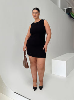 side view of model wearing Princess Polly Osment Knit Mini Dress Black Curve Crew Neck 