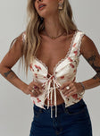 Floral crop top Fixed shoulder straps, lace trim, tie fastening at bust, split hem Non-stretch material, fully lined 