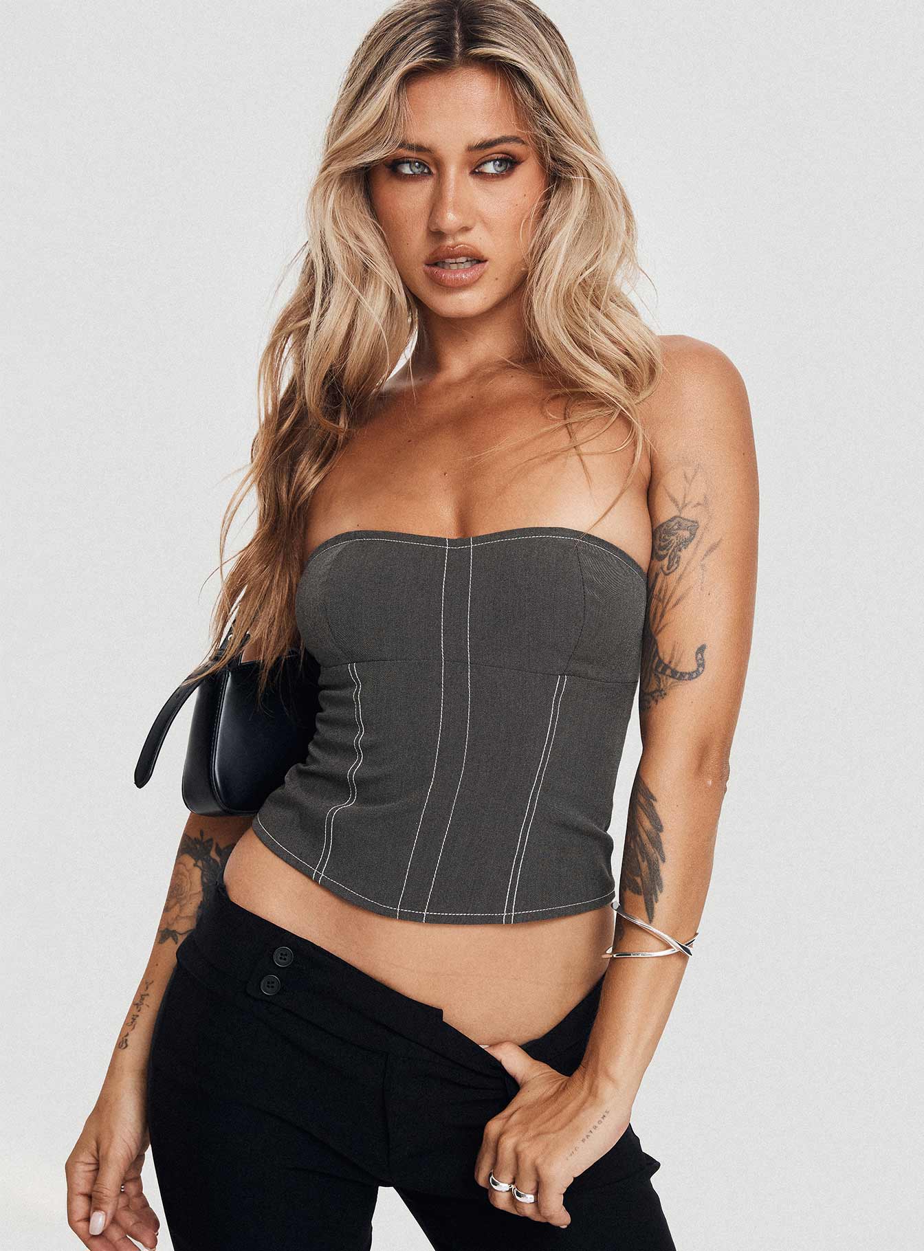 side view of model wearing Princess Polly Vacke Strapless Top Grey Sleeveless Sweetheart 