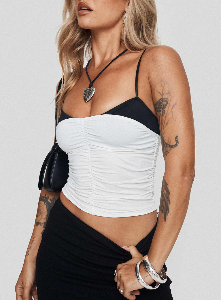 front view of model wearing Princess Polly Vickee Top White / Black Sleeveless Scoop Neck 