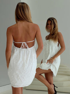 back view of model wearing Princess Polly Daisy Chains Broderie Halter Mini Dress White Scoop Neck 