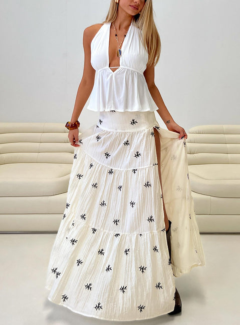   front view of model wearing Princess Polly Cinnamon Embroidered Maxi Skirt Cream / Navy Maxi 