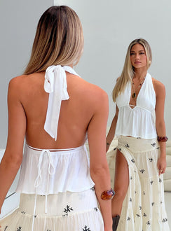 back view of model wearing Princess Polly Saddler Halter Top White Sleeveless Plunger 