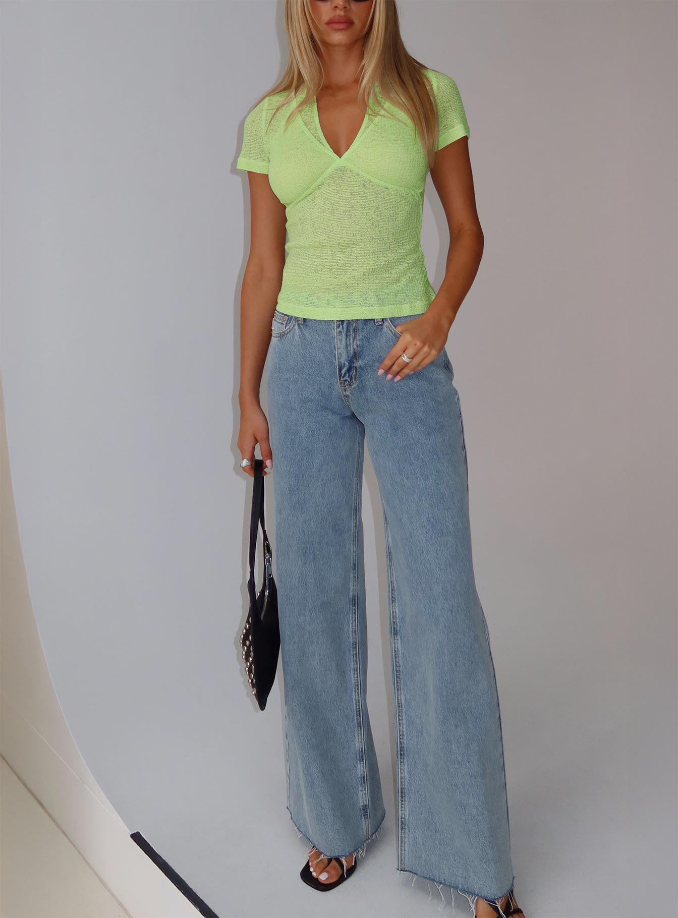 front view of model wearing Princess Polly Darla Low Rise Straight Jean Vintage Blue Wash Low Rise Jeans 