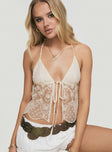 front view of model wearing Princess Polly Astona Lace Halter Cream Sleeveless Plunger 