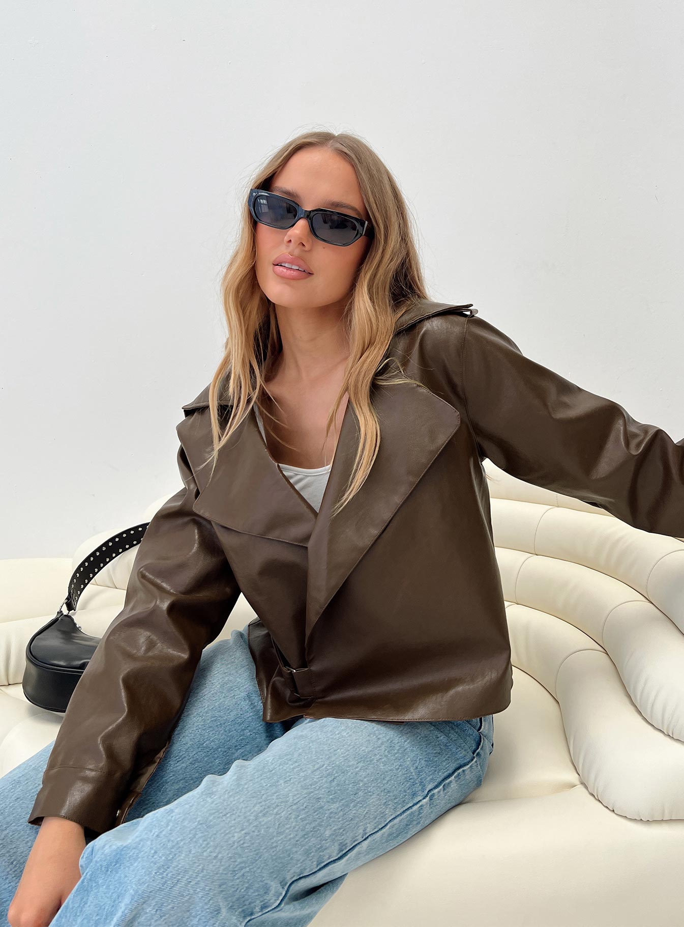 Oversized jacket Faux leather material, lapel collar, button fastening, snap button at cuff Non-stretch, fully lined