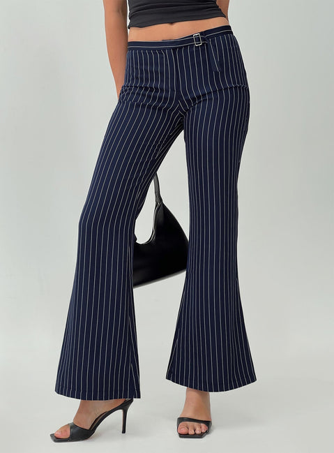 side view of model wearing Princess Polly No One Low Waist Pinstripe Pants Navy Mid Rise 