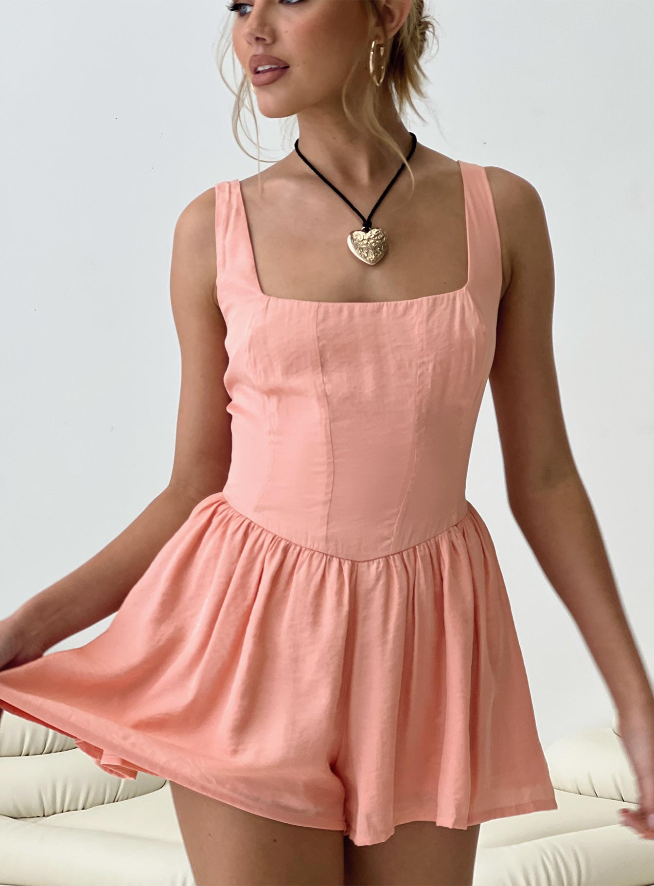 Silky romper Fixed shoulder straps, gathered waist, twin hip pockets, invisible zip fastening at back 