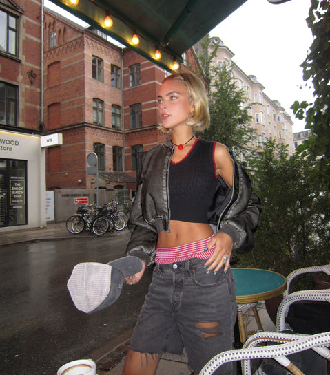 Faux leather bomber jacket High neckline, zip fastening, twin hip pockets, elasticated waistband and cuff Non-stretch material, fully lined 