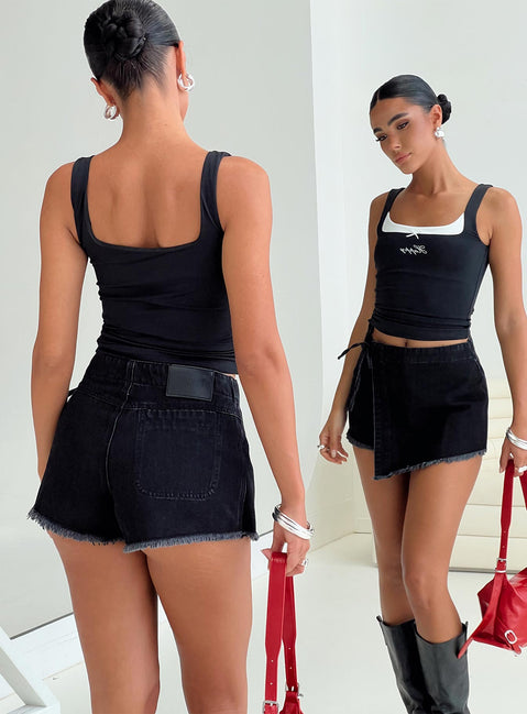back view of model wearing Princess Polly Bowden Skort Washed Black High Waisted Shorts 