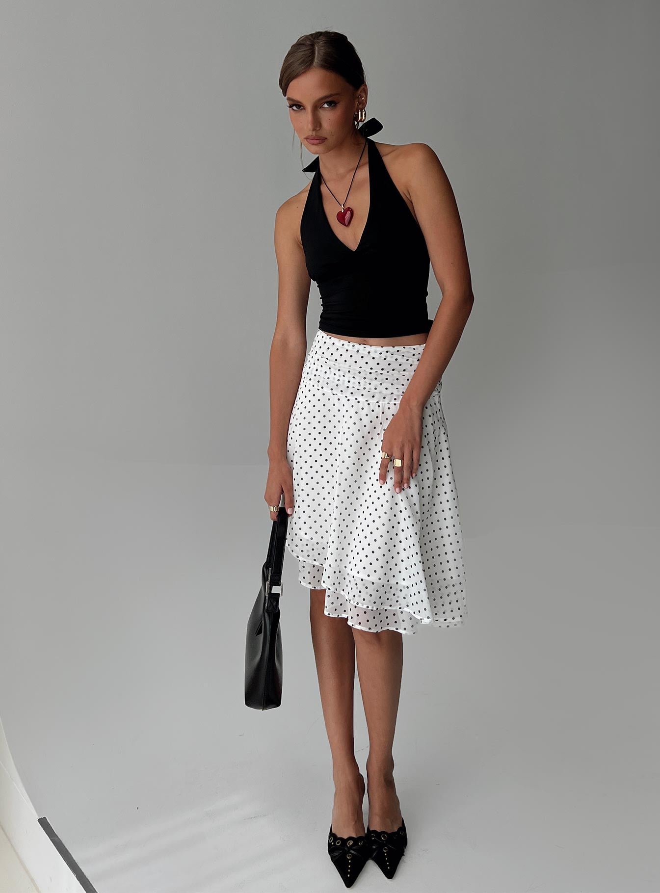 back view of model wearing Princess Polly Evanescence Asymmetrical Midi Skirt White / Polka Dot Midi Skirts 