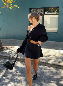 front view of model wearing Princess Polly Reema Skort Black High Waisted Shorts 