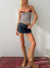 Showcasing the Ladena Mid Rise Double Button Mini Skirt Raw Denim womens-skirts  front view of model wearing Princess Polly