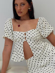 front view of model wearing Princess Polly Passionfruit Linen Blend Top Cream/Black Polka Dot Short Sleeves Square Neck 