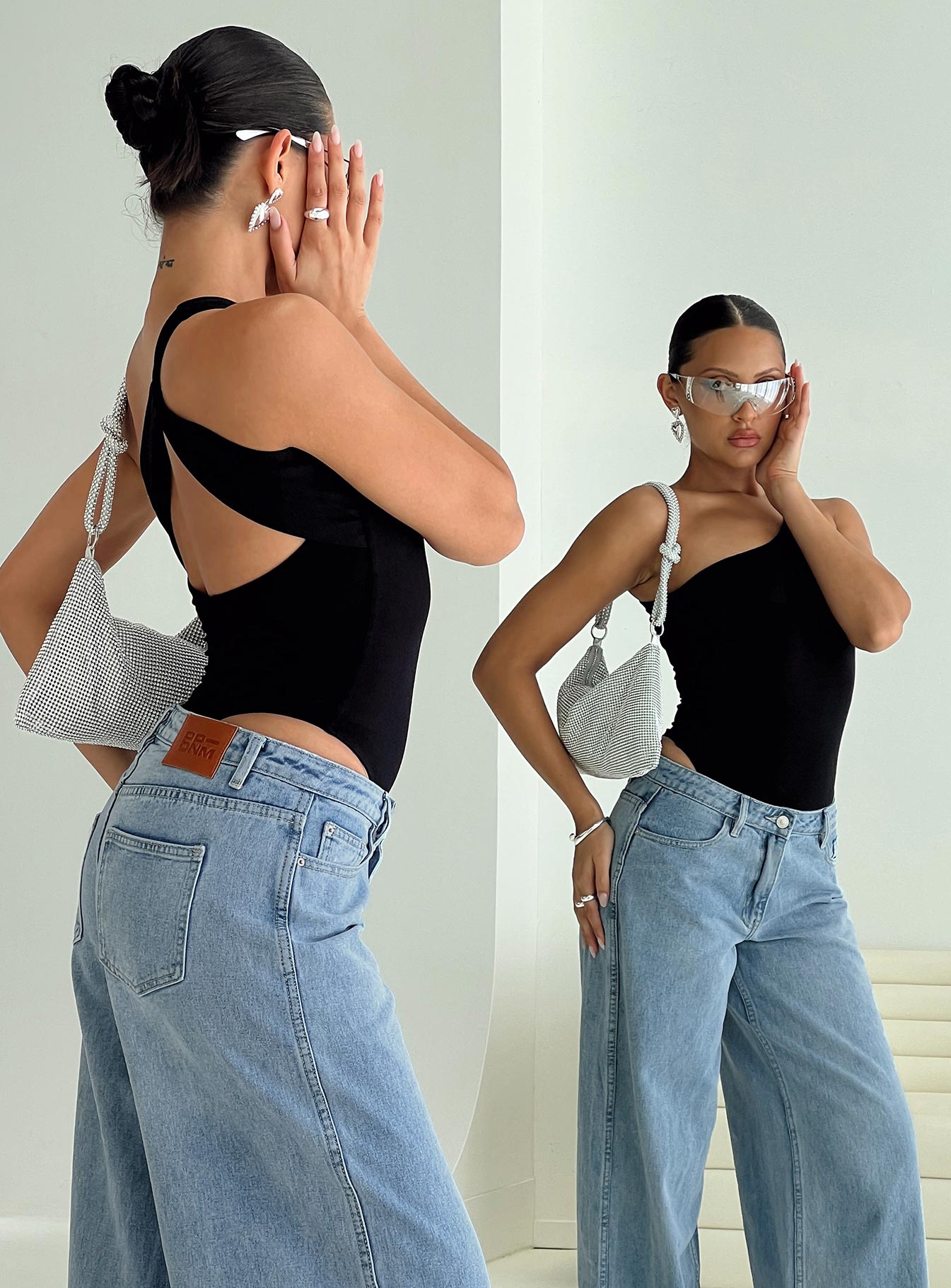 back view of model wearing Princess Polly Seema Bodysuit Black Sleeveless 