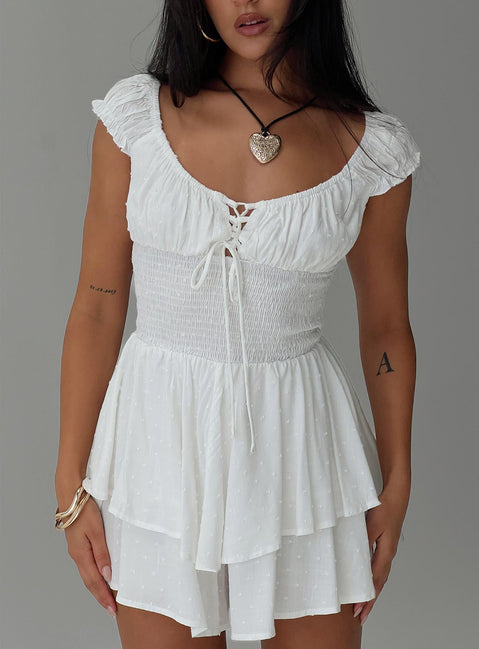 White Romper Cap sleeves, cross over tie fastening at bust, elasticated waist, layered hem