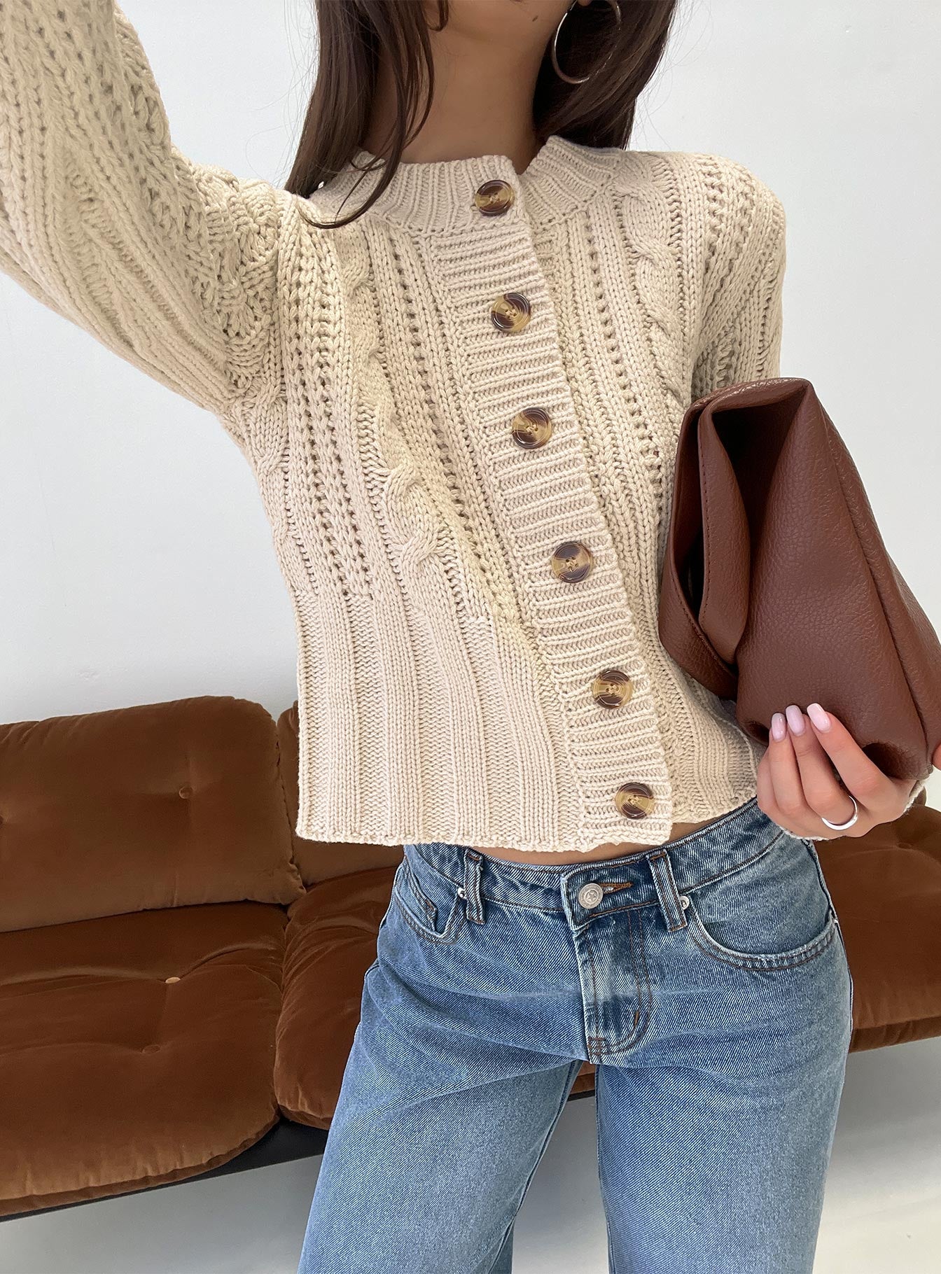 front view of model wearing Princess Polly Donielle Cable Knit Cardigan Beige cropped 