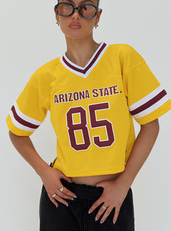 front view of model wearing Princess Polly ASU Football Jersey Gold Half Sleeves V-Neck 