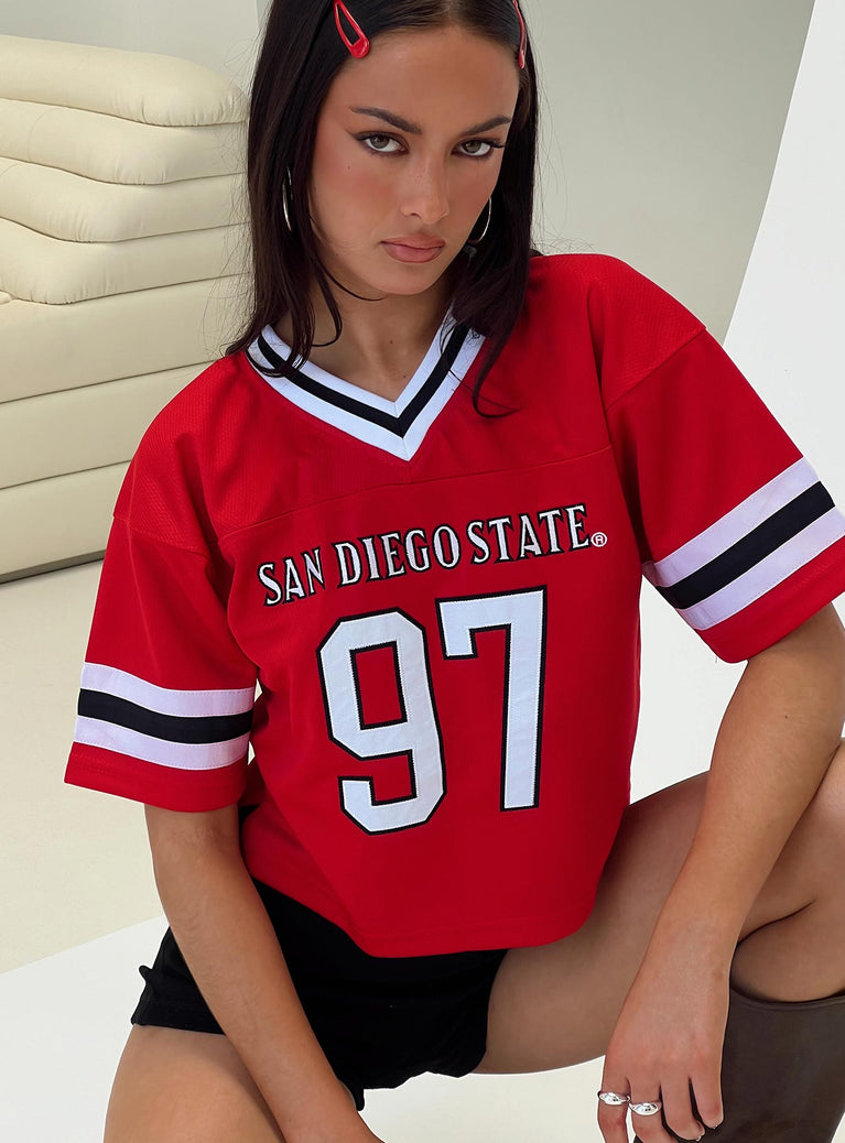 front view of model wearing Princess Polly SDSU Football Jersey Red Half Sleeves V-Neck 