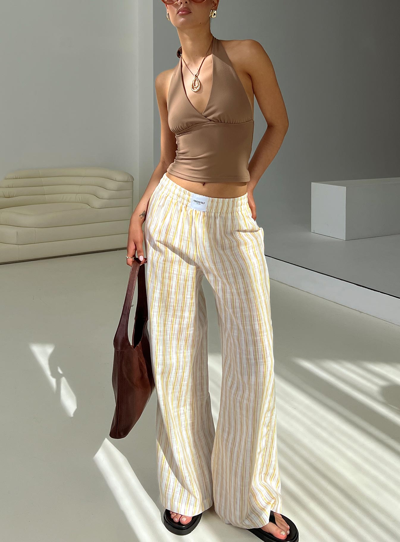 front view of model wearing Princess Polly Beach House Pants Yellow Stripe High Waisted Pants 