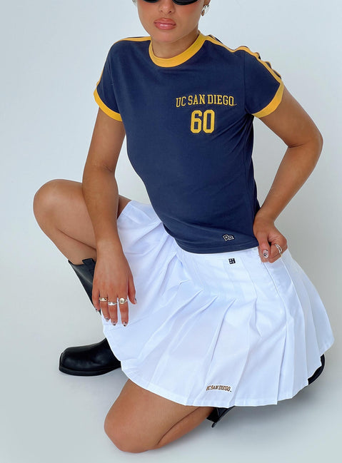   side view of model wearing Princess Polly UCSD Tennis Skort White 