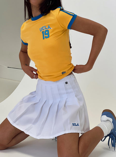   front view of model wearing Princess Polly UCLA Tennis Skort White 
