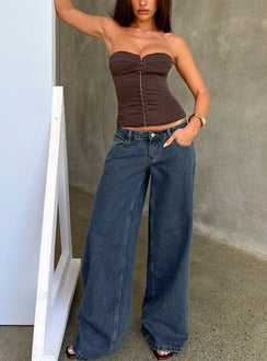 Showcasing Picco Ultra Low Rise Wide Leg Jeans in womens-jeans with dark blue wash front view of model wearing Princess Polly