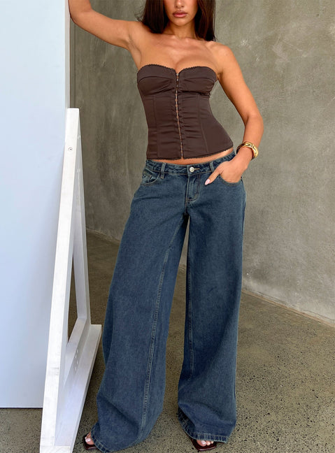 Showcasing Picco Ultra Low Rise Wide Leg Jeans in womens-jeans with dark blue wash front view of model wearing Princess Polly