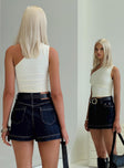 back view of model wearing Princess Polly Heuston Denim Skort Dark Wash Lower Impact High Waisted Shorts 