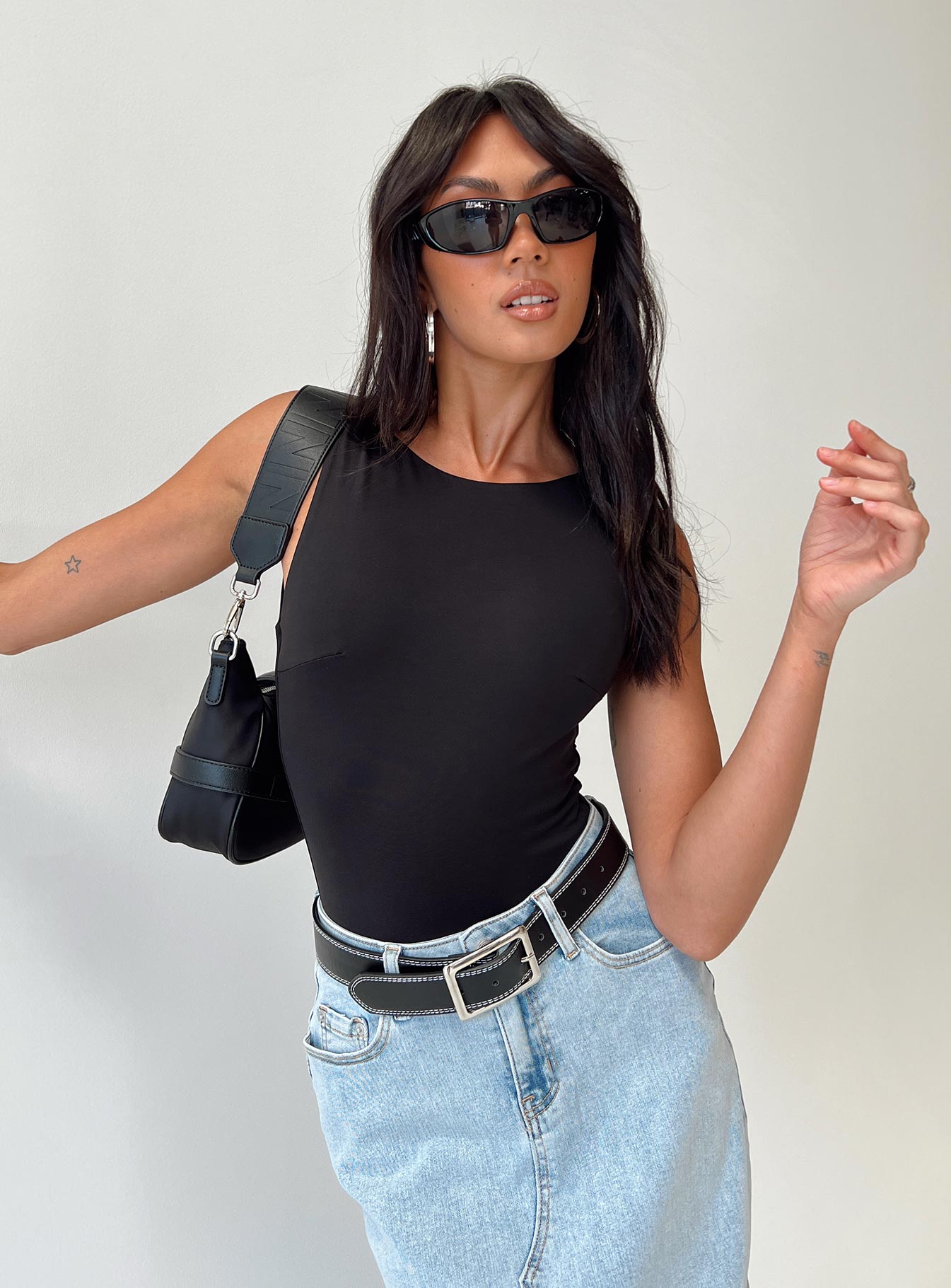 front view of model wearing Princess Polly Beresford Bodysuit Black Sleeveless Scoop Neck 