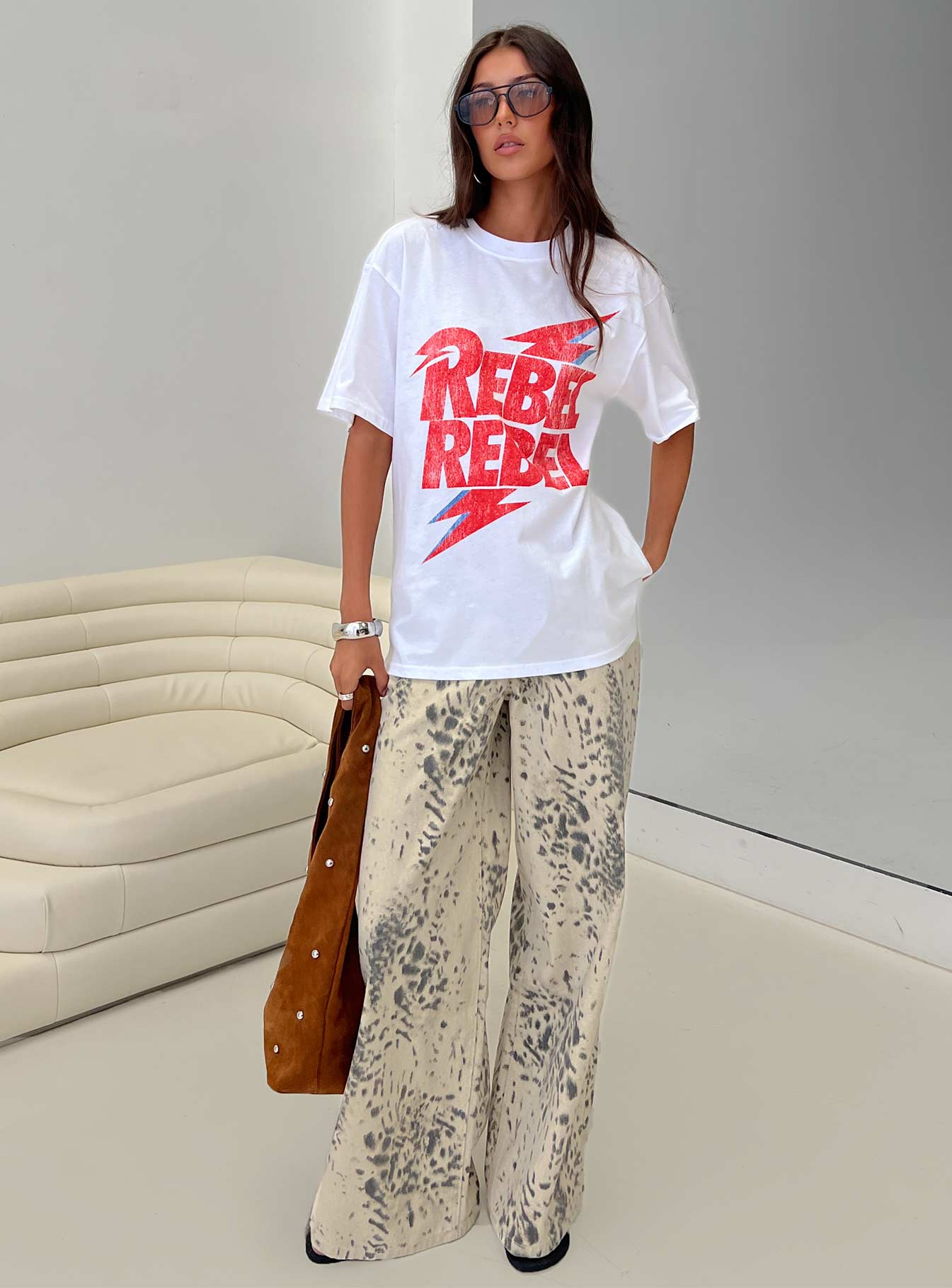 front view of model wearing Princess Polly Naylor Mid Rise Wide Leg Jeans Animal Spot Mid Rise Jeans 