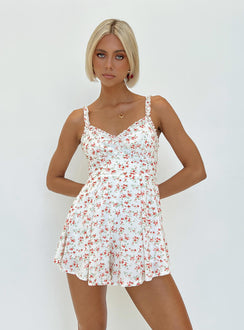 Romper Floral print Ruffle detailing Open back with tie Invisible zip at back Elasticated backband Fixed straps Fully lined