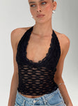 side view of model wearing Princess Polly Only Angel Halter Top Black Sleeveless Scoop Neck 