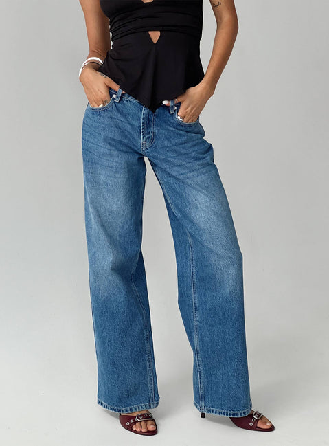 front view of model wearing Princess Polly Serenitia Mid Rise Relaxed Jeans Mid Blue Wash Tall Mid Rise 