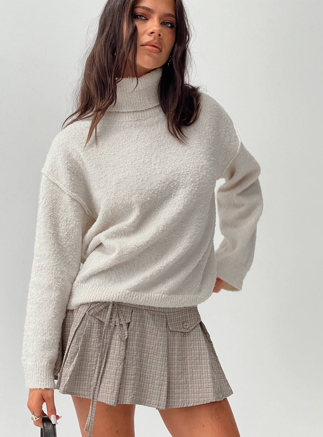 side view of model wearing Princess Polly Finnien Boucle Turtleneck Sweater Cream Long 