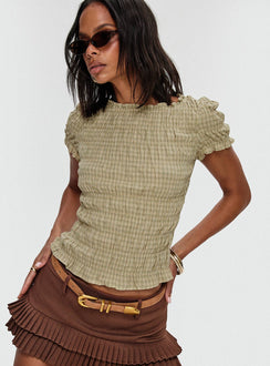side view of model wearing Princess Polly Romelle Shirred Top Green / Brown Plaid Short Sleeves Crew Neck 
