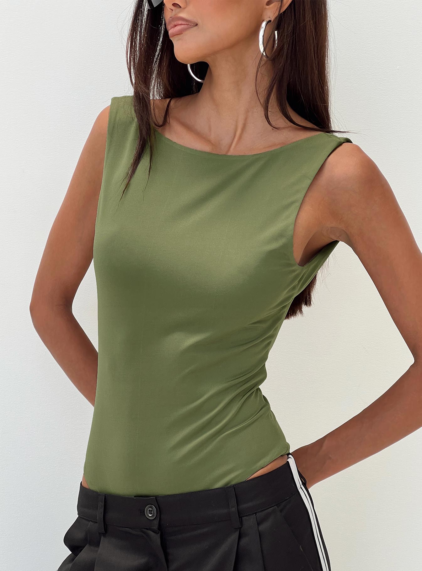 side view of model wearing Princess Polly Coomba Backless Bodysuit Green Sleeveless Boat Neck 